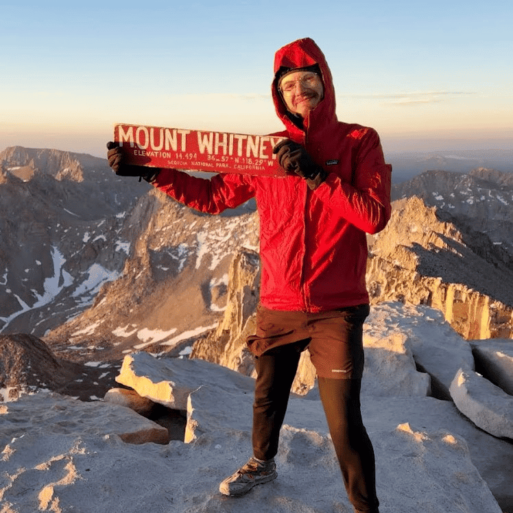 Me holding the Mt Whitney plaque at the summit