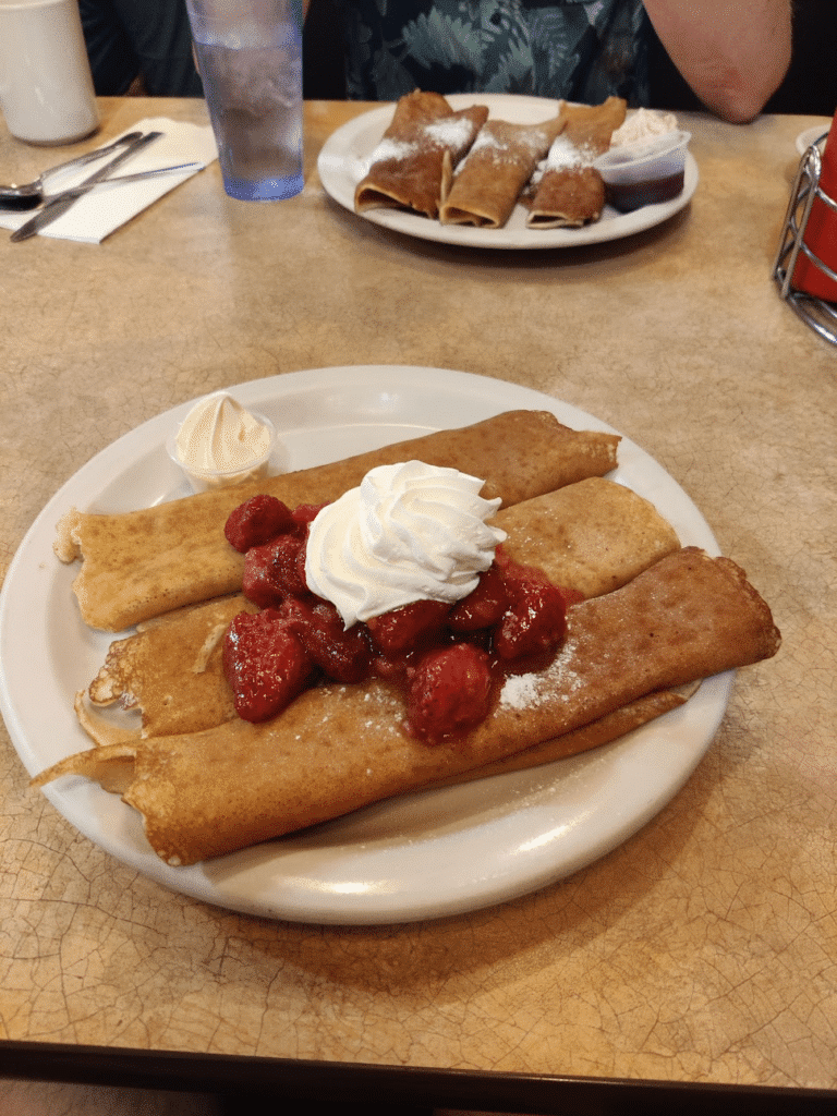 Snoqualmie pancakes with cream and strawberries