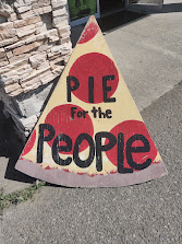 A pizza sign reading: 'Pie for the people'