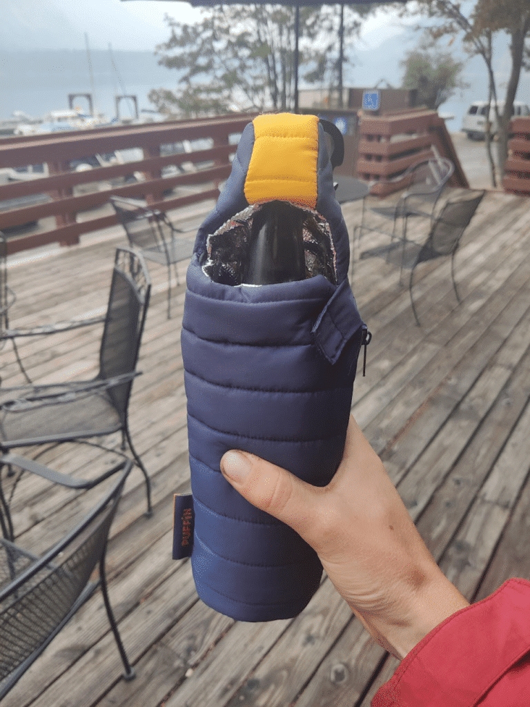 A beer cozy in the shape of a mummy sleeping bag