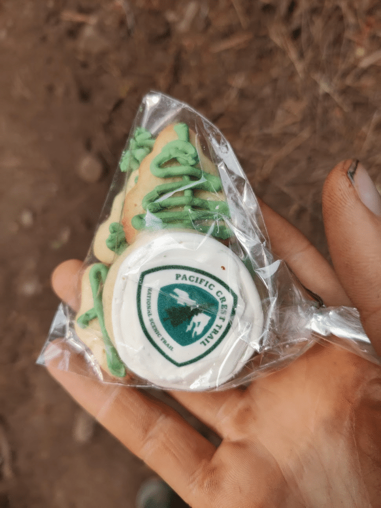 A cookie with the PCT logo on it